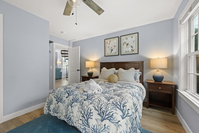 bedroom featuring ceiling fan and light wood-type flooring