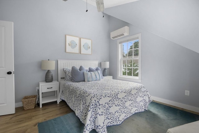 bedroom featuring an AC wall unit, dark wood-type flooring, and vaulted ceiling