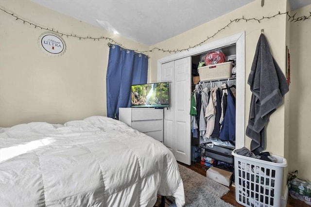 bedroom with a closet and wood finished floors