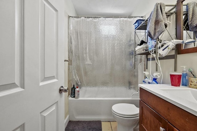 bathroom with toilet, shower / bath combo, vanity, and tile patterned floors