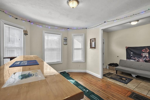 interior space featuring wood finished floors and baseboards