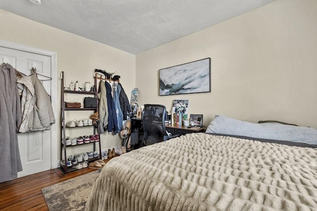 bedroom featuring dark wood-style floors