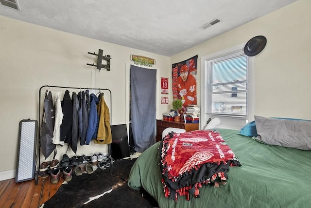 bedroom featuring visible vents