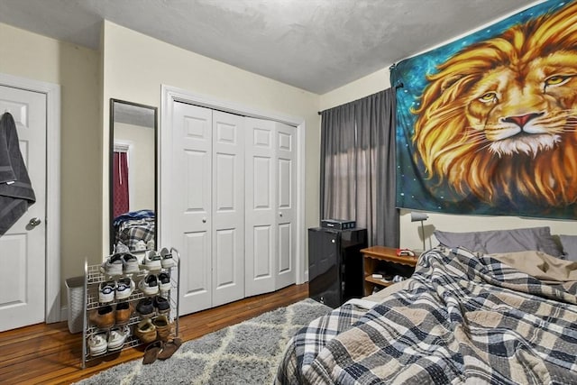 bedroom featuring a closet and wood finished floors