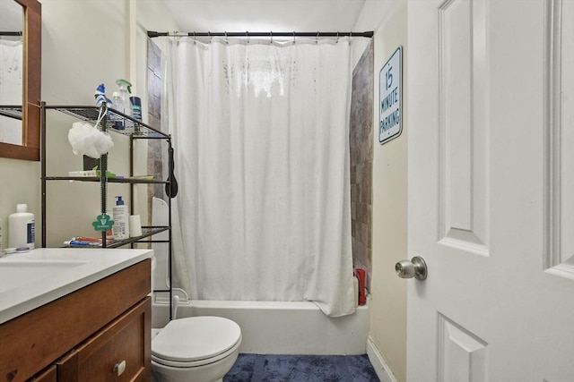 bathroom with toilet, shower / tub combo, and vanity