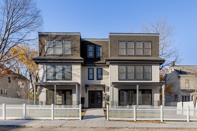 18-20 Parkman St Unit 1, Boston, MA 02122 - multi unit property featuring a fenced front yard, covered porch, and roof with shingles