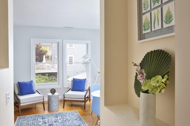4 Perry St Unit 2, Brookline, MA 02445 - living area featuring healthy amount of natural light and wood finished floors