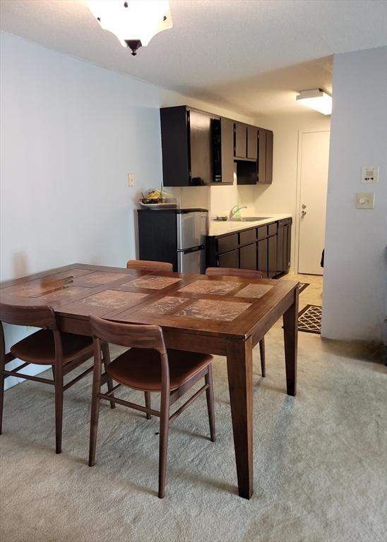 1 Post Oak Ln Unit 21, Natick, MA 01760 - dining room featuring light carpet and bar area