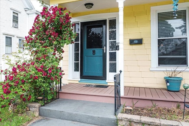 67 Pine St, Milford, MA 01757 - doorway to property featuring a porch