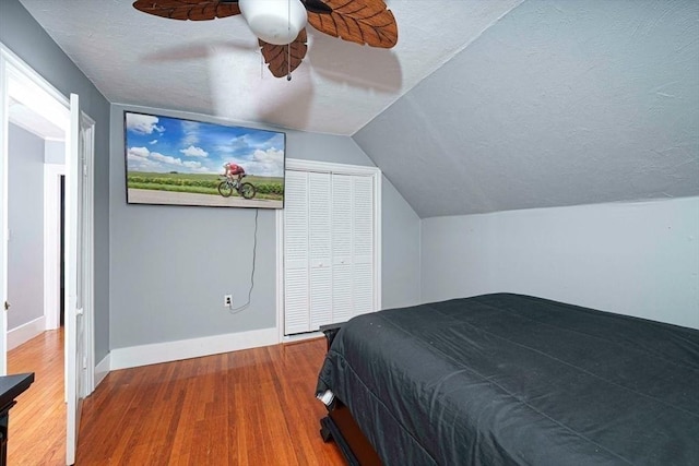 67 Pine St, Milford, MA 01757 - bedroom with wood finished floors, a textured ceiling, lofted ceiling, baseboards, and ceiling fan