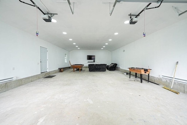 67 Pine St, Milford, MA 01757 - garage with recessed lighting, a garage door opener, and a baseboard heating unit