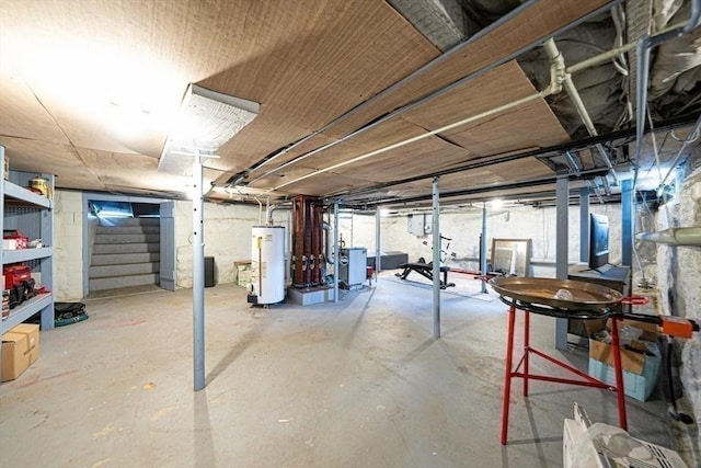 67 Pine St, Milford, MA 01757 - unfinished basement with water heater and stairway