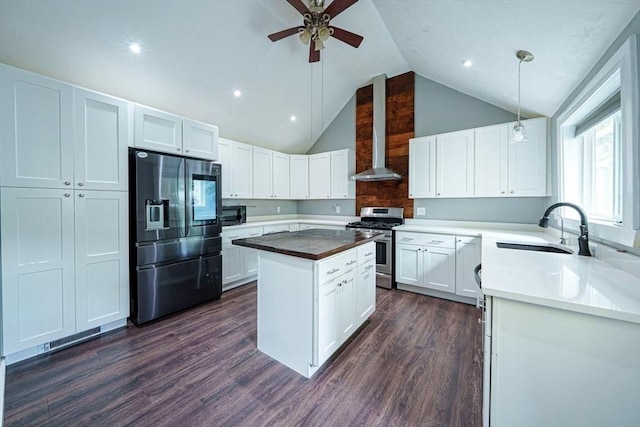 67 Pine St, Milford, MA 01757 - kitchen with appliances with stainless steel finishes, wall chimney exhaust hood, a sink, a kitchen island, and dark wood-type flooring