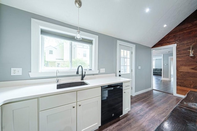 67 Pine St, Milford, MA 01757 - kitchen featuring dishwasher, wood walls, a sink, dark wood-style flooring, and white cabinetry