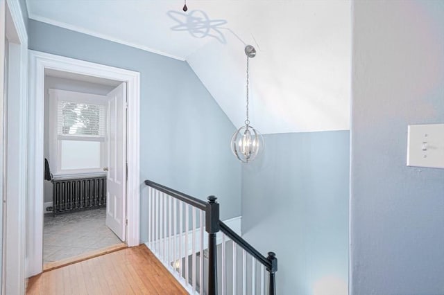 67 Pine St, Milford, MA 01757 - stairs with wood-type flooring, lofted ceiling, a chandelier, and ornamental molding