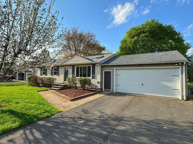ranch-style house with a front yard, a garage, and driveway