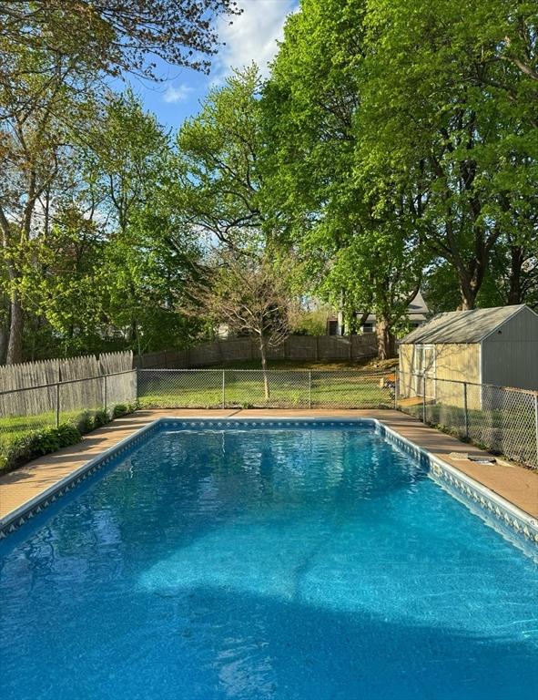 view of swimming pool featuring a fenced in pool and a fenced backyard
