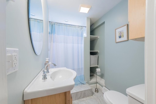 bathroom featuring toilet, vanity, and a shower with shower curtain