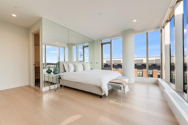 bedroom with light wood-type flooring