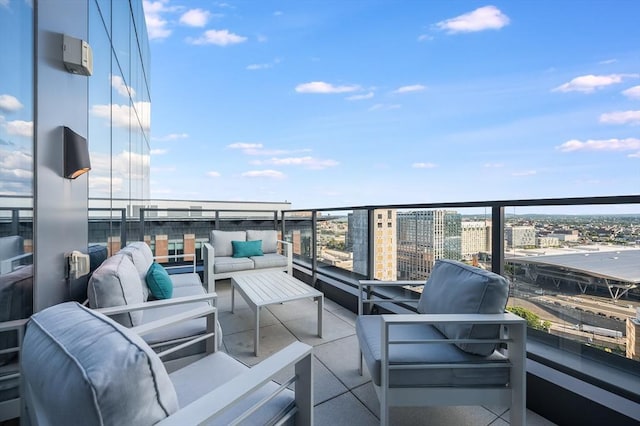 balcony featuring a view of city and an outdoor hangout area