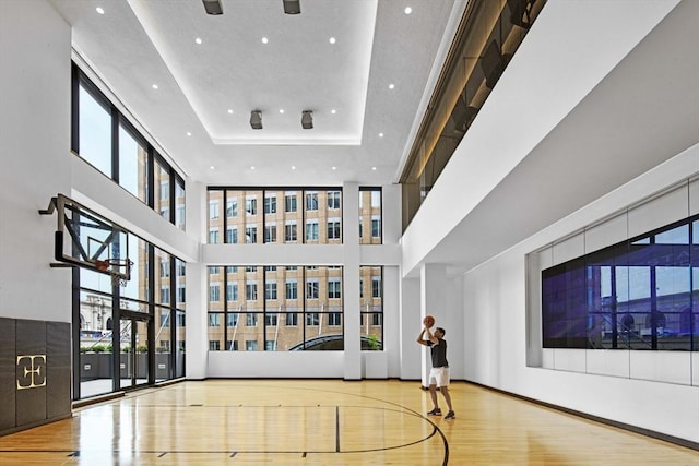 view of sport court with community basketball court and a healthy amount of sunlight