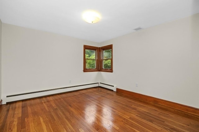 19 Chase St, Taunton, MA 02780 - unfurnished room featuring a baseboard heating unit and wood finished floors