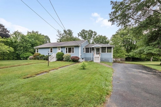 19 Chase St, Taunton, MA 02780 - ranch-style home featuring asphalt driveway, a sunroom, and a front yard