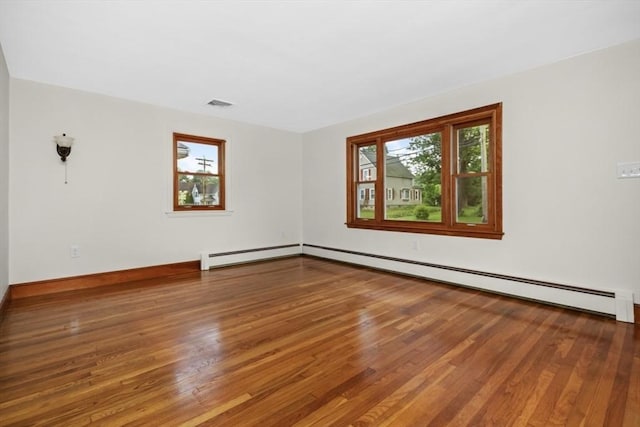 19 Chase St, Taunton, MA 02780 - spare room with wood finished floors and a baseboard radiator