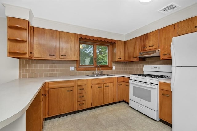 19 Chase St, Taunton, MA 02780 - kitchen with white appliances, under cabinet range hood, light countertops, tasteful backsplash, and light floors