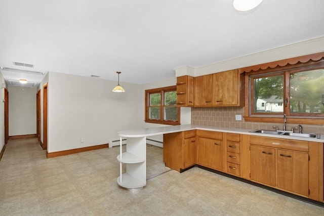 19 Chase St, Taunton, MA 02780 - kitchen with open shelves, light countertops, a peninsula, light floors, and brown cabinetry