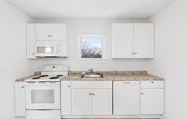 kitchen with crown molding, sink, white appliances, and white cabinets