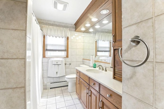 bathroom with tile patterned flooring, a baseboard radiator, tile walls, toilet, and vanity