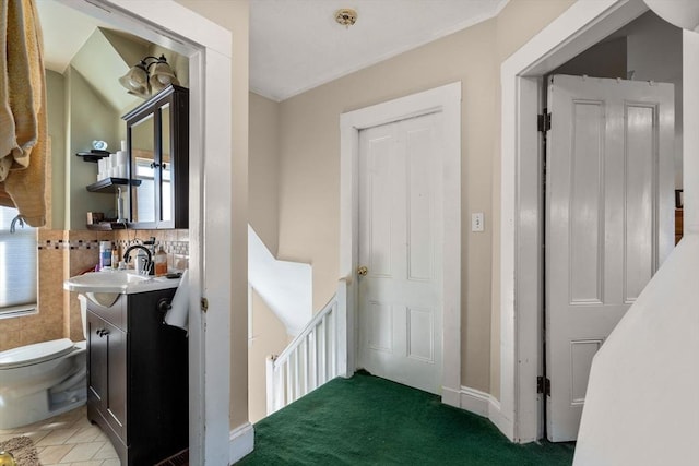 half bath featuring toilet and vanity