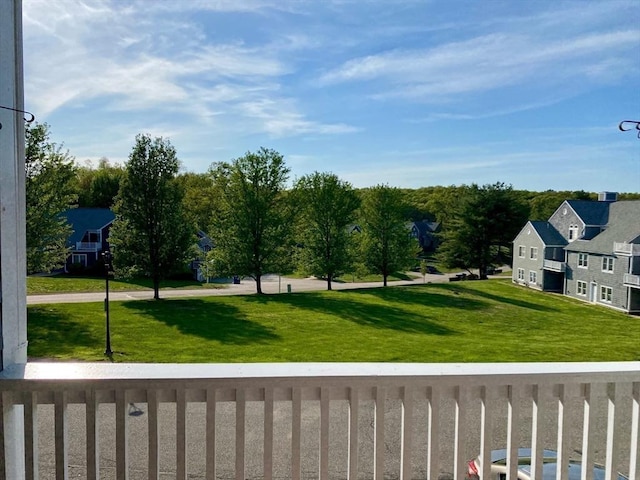 surrounding community with a lawn and a residential view