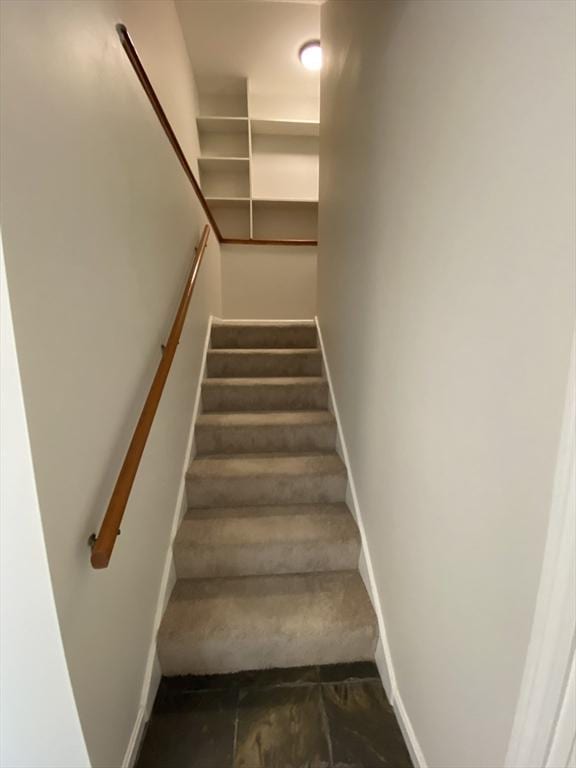 stairway with baseboards