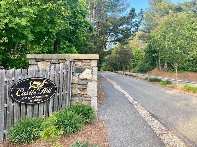 community sign with fence