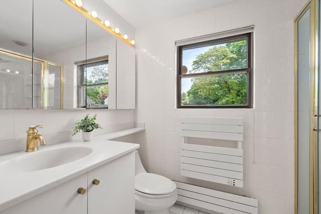 full bath featuring a baseboard radiator, healthy amount of natural light, a stall shower, toilet, and tile walls