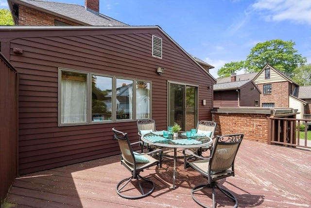 wooden deck featuring outdoor dining space