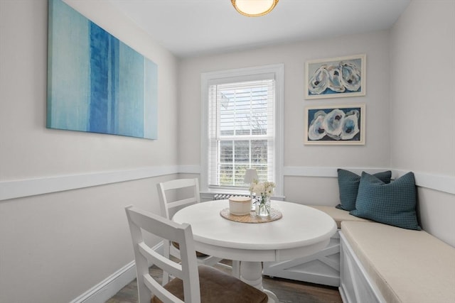 dining area with dark wood-type flooring