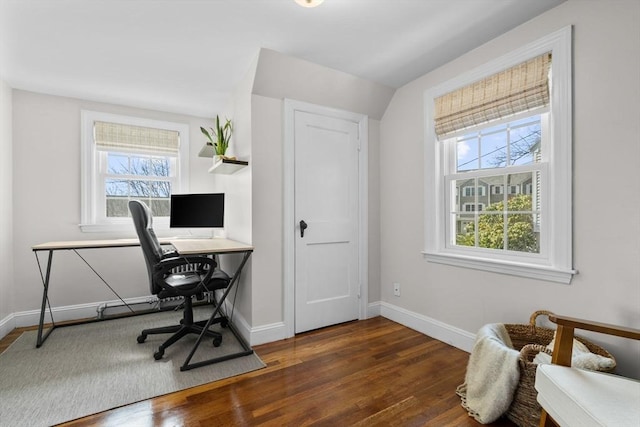 office space with baseboards and wood finished floors