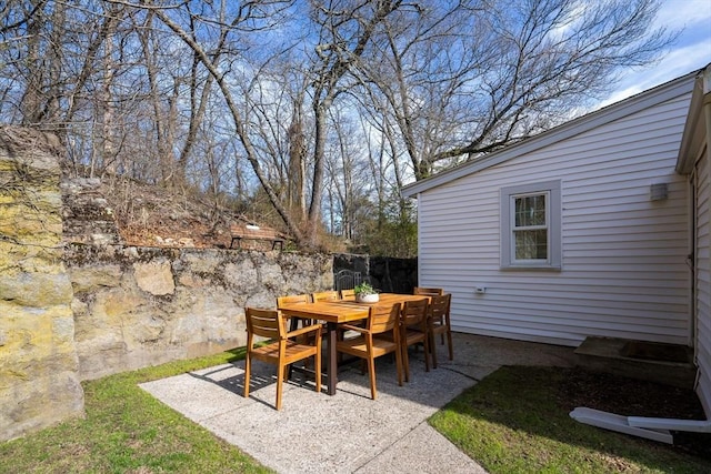 view of patio featuring fence and outdoor dining area
