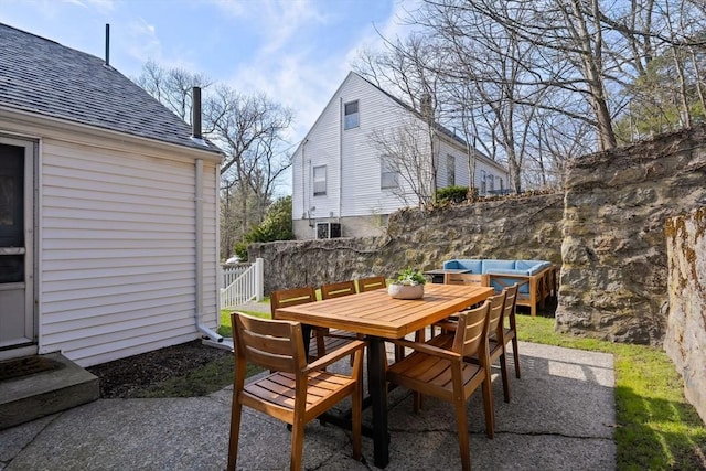 view of patio with outdoor dining area and central AC