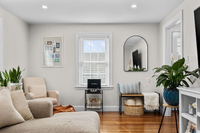 sitting room with recessed lighting, baseboards, and wood finished floors