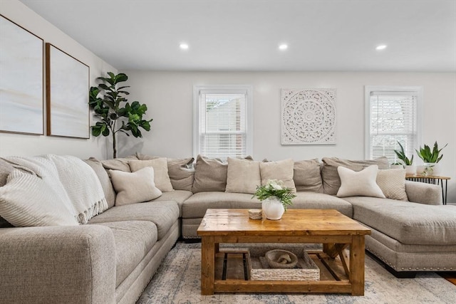 living room featuring light wood-type flooring and recessed lighting