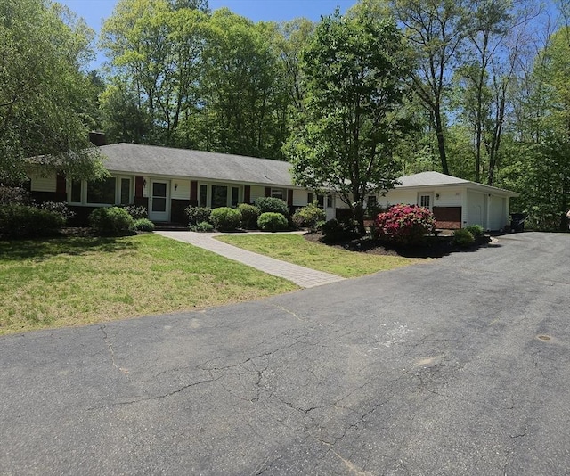ranch-style house with a front lawn