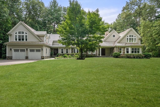 view of front of house featuring a garage and a front yard