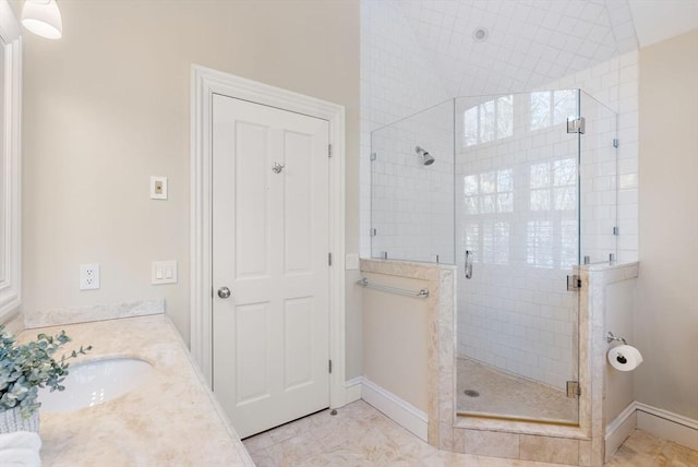 bathroom with tile patterned floors, vanity, and a shower with shower door