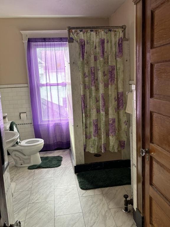 bathroom with toilet and walk in shower