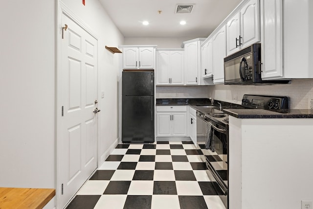 kitchen featuring decorative backsplash, white cabinets, black appliances, and sink