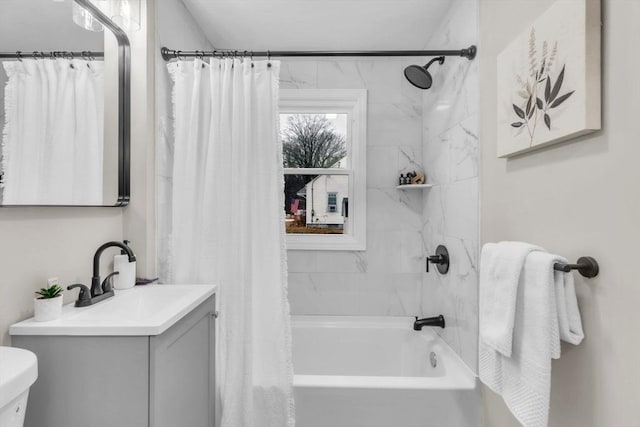 full bathroom featuring vanity, shower / tub combo, and toilet